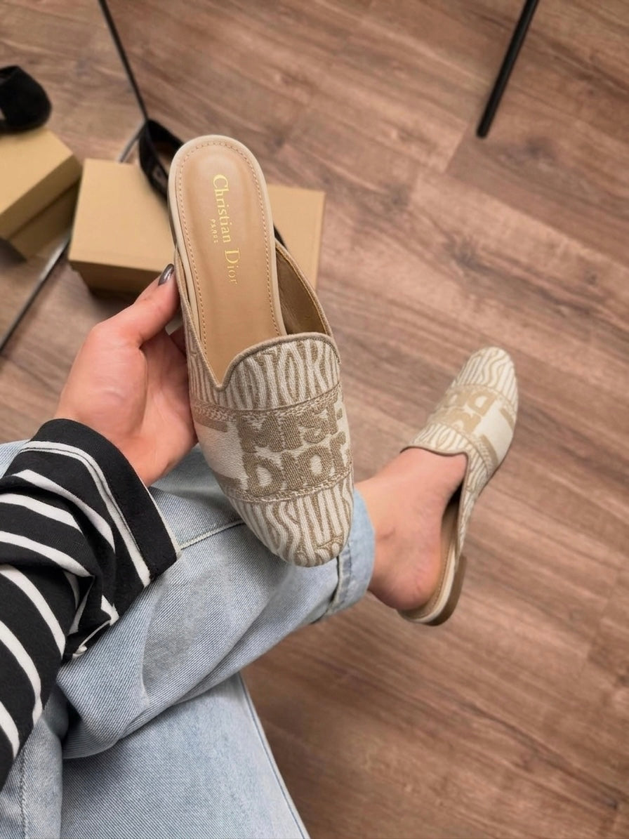 Miss D off Mule Slide Clogs