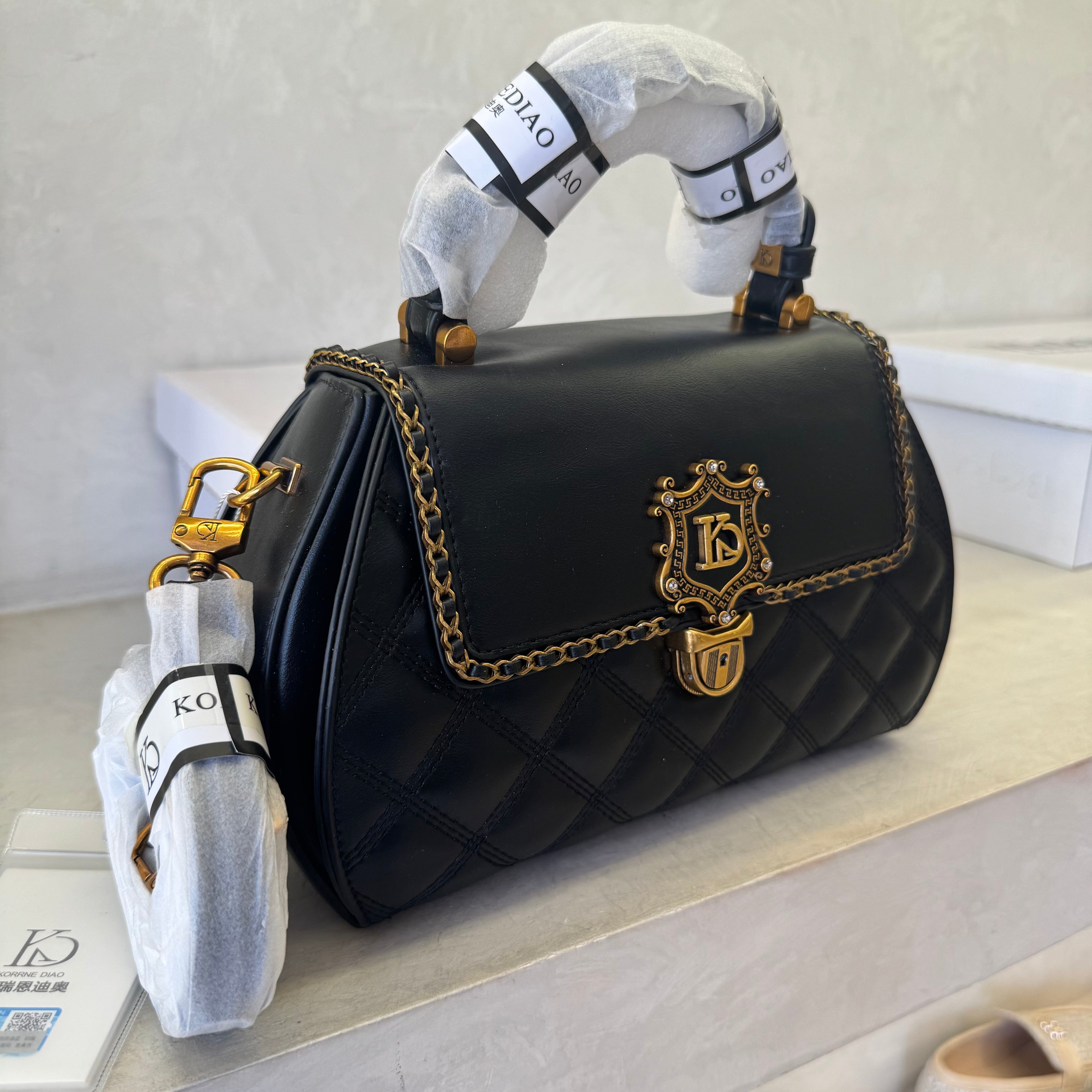 Vintage Emblem Quilted Crossbody Bag