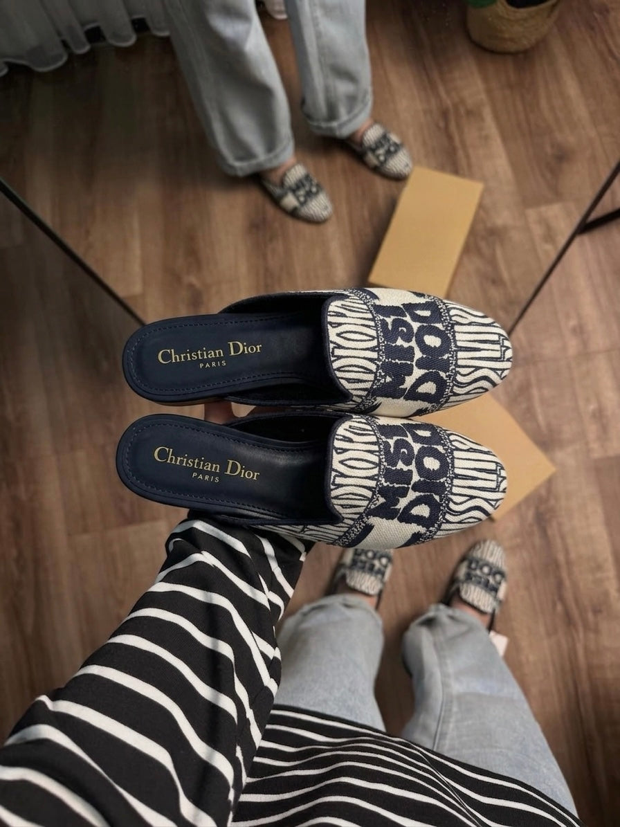 Miss D off Mule Slide Clogs